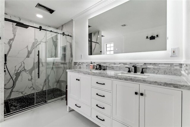 bathroom with walk in shower, ornamental molding, backsplash, and vanity