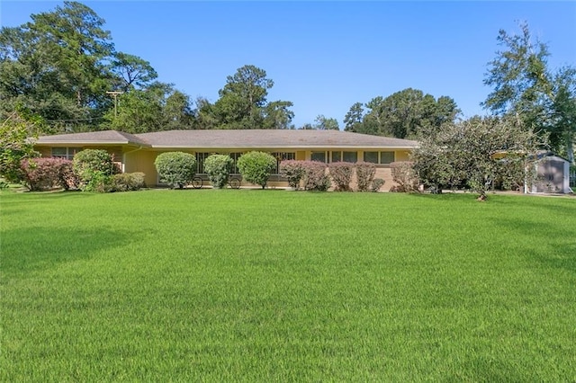 ranch-style house with a front yard