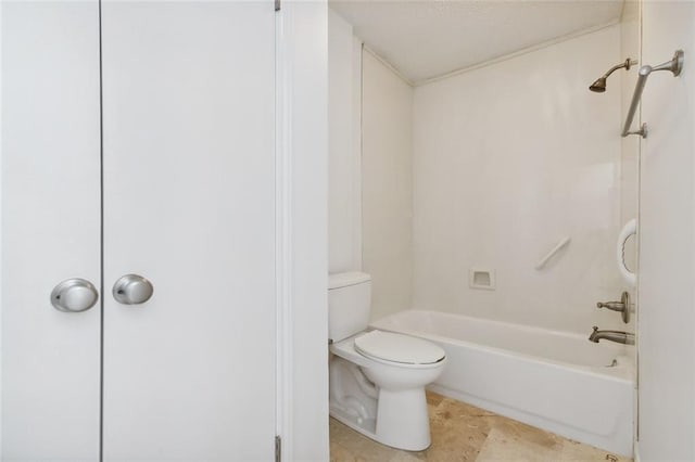 bathroom with washtub / shower combination and toilet