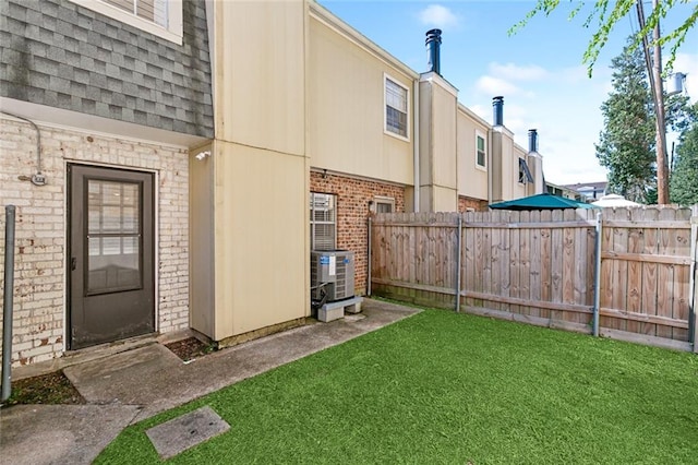 view of yard featuring central air condition unit