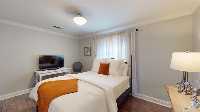 bedroom featuring ornamental molding and dark hardwood / wood-style flooring