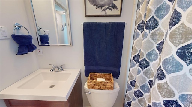 bathroom with vanity and toilet