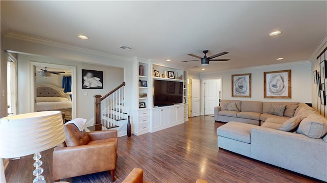 living room with ornamental molding, ceiling fan, and dark hardwood / wood-style floors