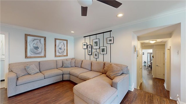 living room featuring ornamental molding, ceiling fan, and dark hardwood / wood-style flooring