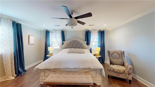 bedroom featuring hardwood / wood-style flooring, multiple windows, ceiling fan, and crown molding