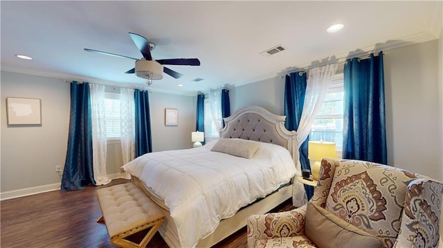 bedroom with multiple windows, ceiling fan, crown molding, and dark hardwood / wood-style flooring