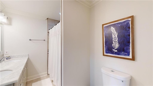 bathroom featuring vanity, ornamental molding, toilet, and a shower with shower curtain