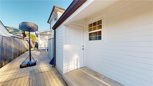 property entrance featuring a patio area