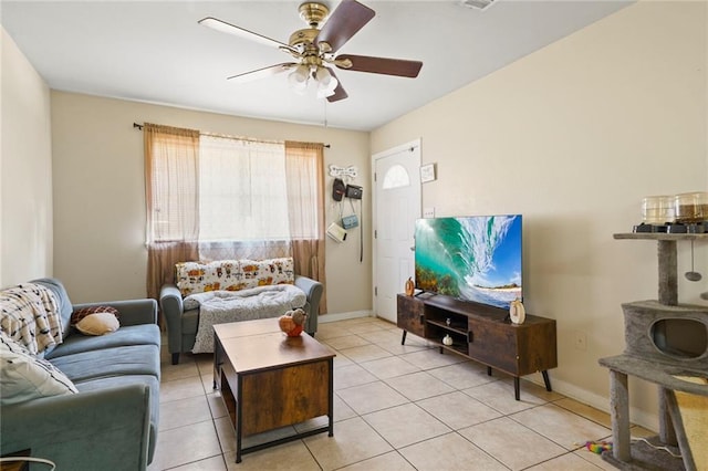 tiled living room featuring ceiling fan