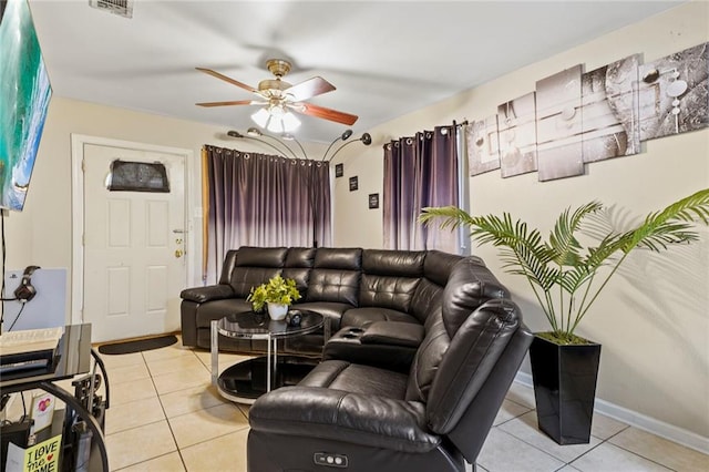 tiled living room with ceiling fan