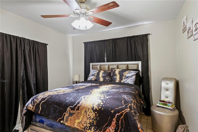 bedroom with tile patterned floors and ceiling fan