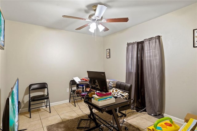 office space featuring ceiling fan and light tile patterned floors