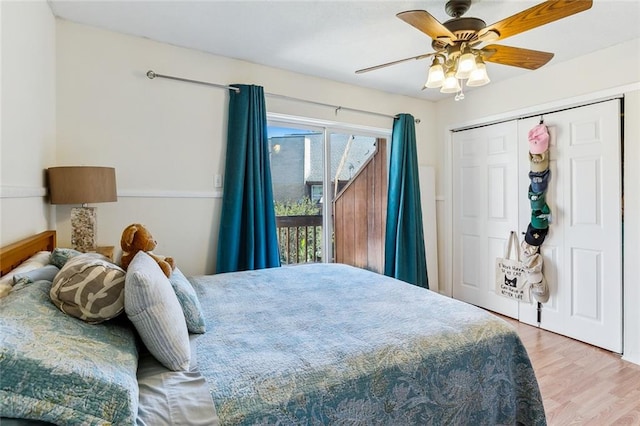 bedroom featuring hardwood / wood-style floors, access to exterior, a closet, and ceiling fan