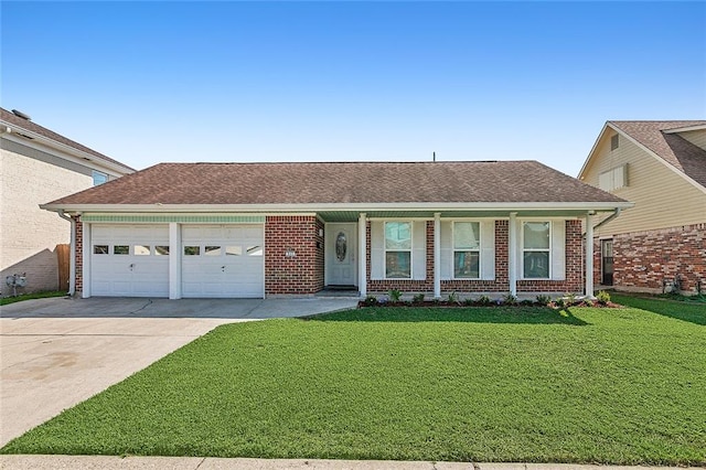 ranch-style house with a garage and a front lawn