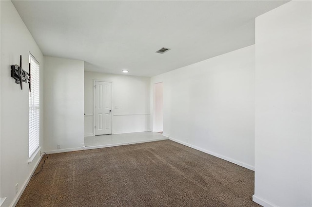 spare room featuring carpet floors