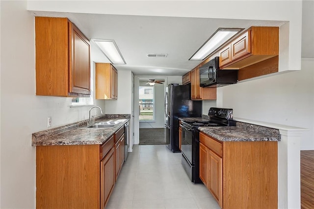 kitchen with black appliances, ceiling fan, and sink