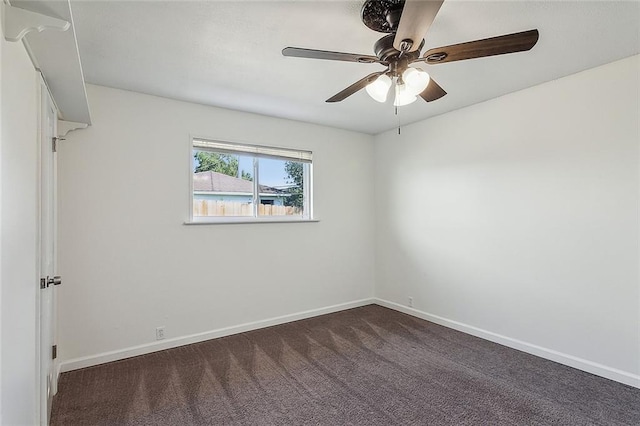 carpeted empty room featuring ceiling fan