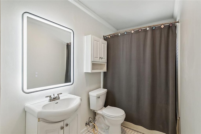 bathroom featuring tile patterned flooring, vanity, toilet, and ornamental molding