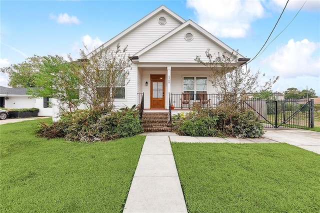 bungalow featuring a porch and a front yard