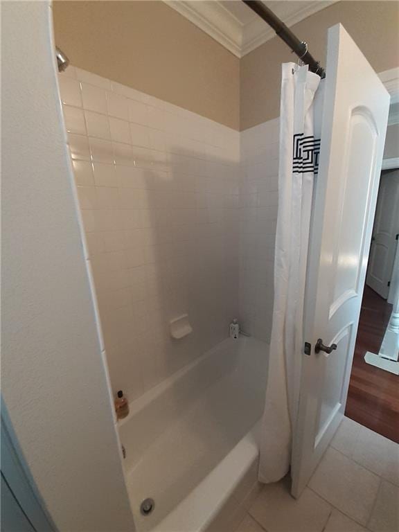 bathroom with ornamental molding, tile patterned flooring, and shower / tub combo with curtain