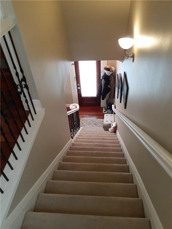 staircase featuring hardwood / wood-style flooring