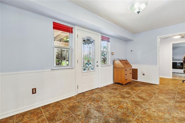 foyer featuring plenty of natural light