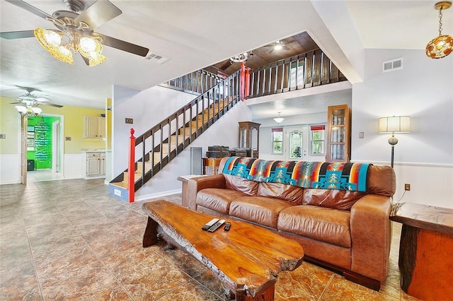 living room featuring lofted ceiling and ceiling fan