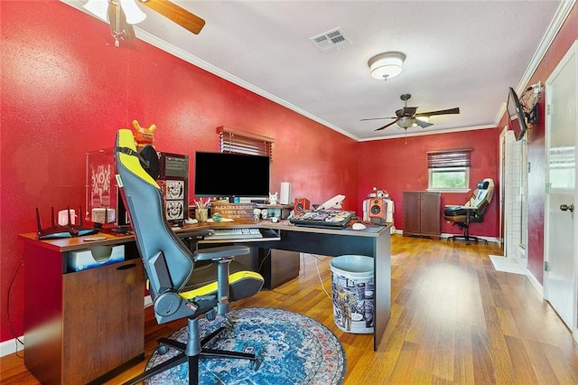 office area with ornamental molding, light wood-type flooring, and ceiling fan