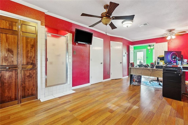 home office with ornamental molding, light hardwood / wood-style flooring, and ceiling fan