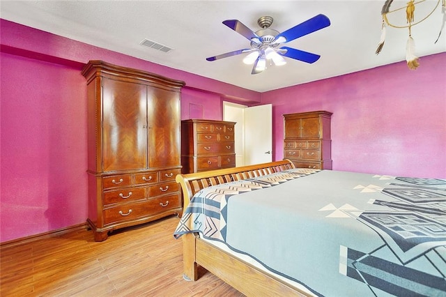 bedroom featuring light hardwood / wood-style floors and ceiling fan