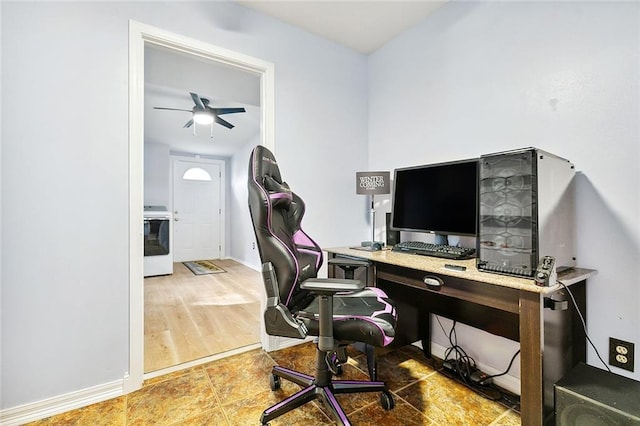 office featuring washer / dryer, ceiling fan, and hardwood / wood-style floors