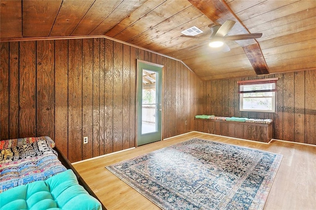 bonus room featuring lofted ceiling, wood ceiling, hardwood / wood-style flooring, and a healthy amount of sunlight