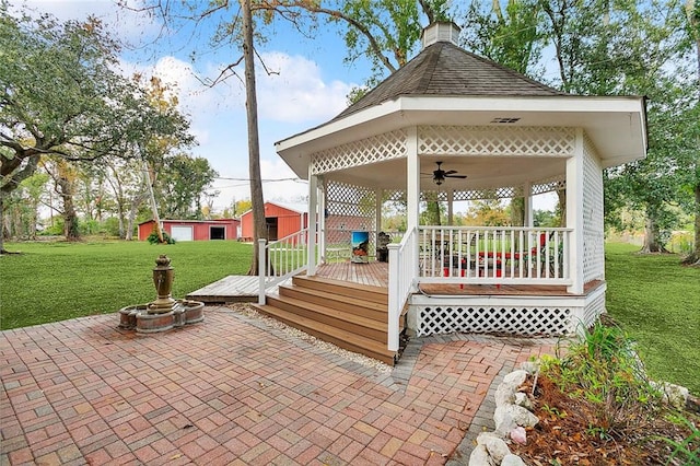 view of patio with a deck and an outbuilding