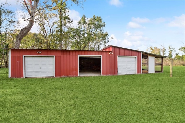 garage with a yard