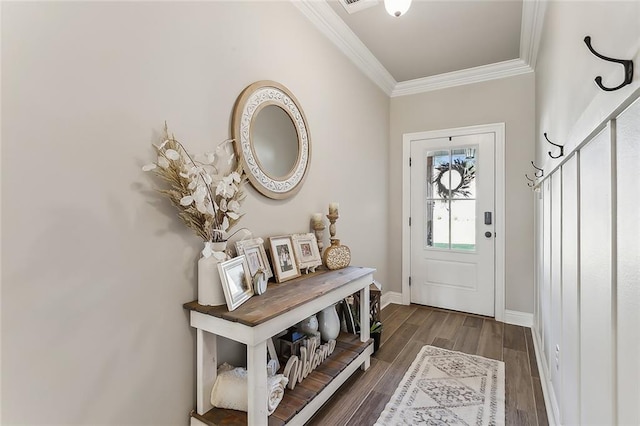 foyer with dark hardwood / wood-style floors and ornamental molding