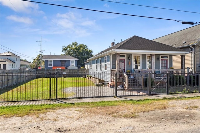 bungalow featuring a front yard and covered porch