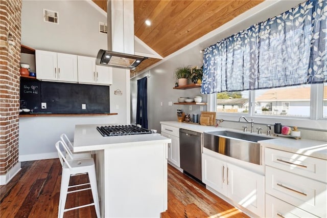 kitchen with wood-type flooring, island exhaust hood, wood ceiling, stainless steel appliances, and white cabinetry