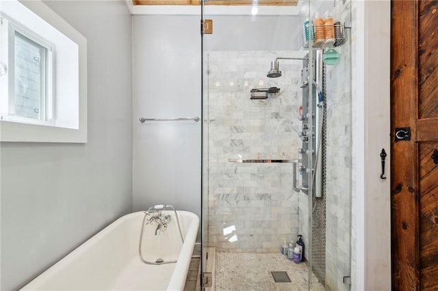 bathroom featuring separate shower and tub