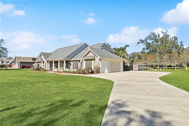 craftsman house featuring a garage and a front lawn