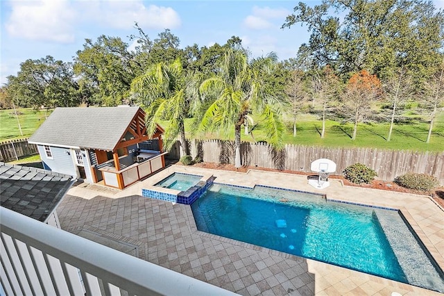 view of swimming pool featuring an in ground hot tub and a patio