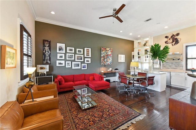 living room with crown molding, ceiling fan, and dark wood-type flooring