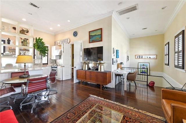 interior space featuring crown molding and dark hardwood / wood-style flooring