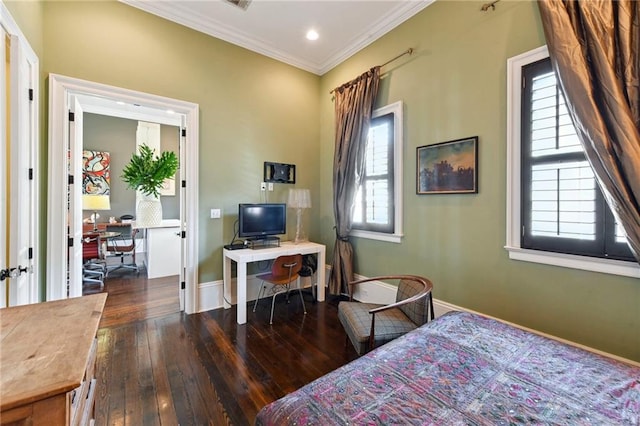 bedroom featuring dark hardwood / wood-style floors, ornamental molding, and multiple windows