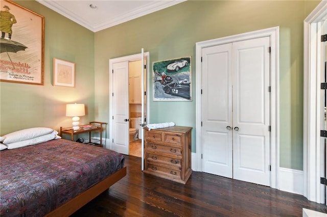 bedroom with ornamental molding, a closet, and dark hardwood / wood-style flooring