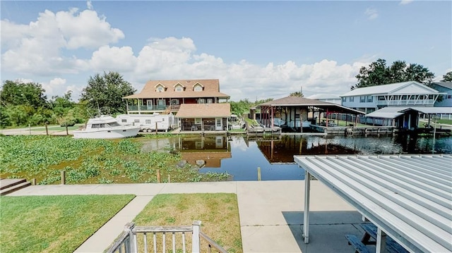 dock area featuring a yard and a water view