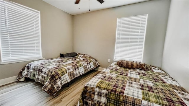 bedroom featuring ceiling fan and hardwood / wood-style floors