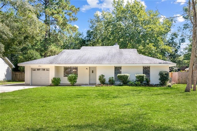 single story home featuring a garage and a front lawn