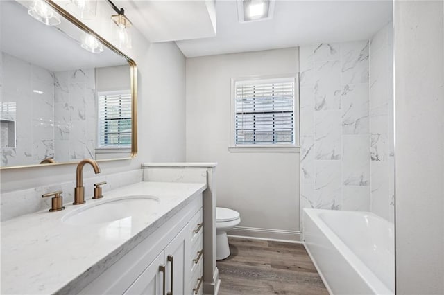 bathroom featuring hardwood / wood-style floors, toilet, and vanity