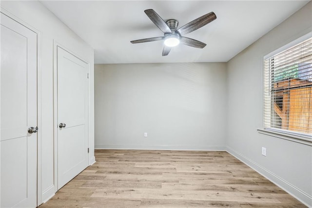 unfurnished bedroom featuring ceiling fan and light hardwood / wood-style flooring