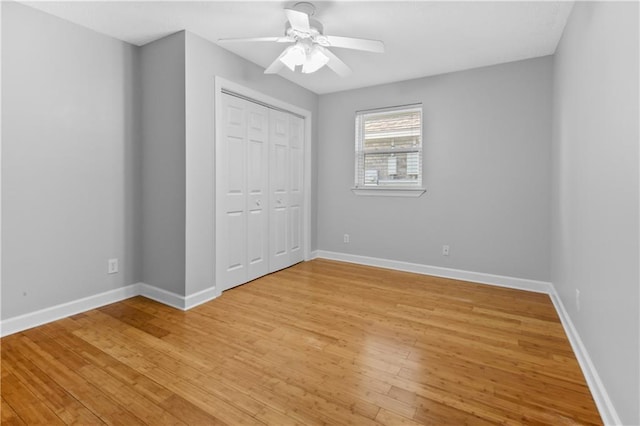 unfurnished bedroom with a closet, ceiling fan, and light hardwood / wood-style flooring